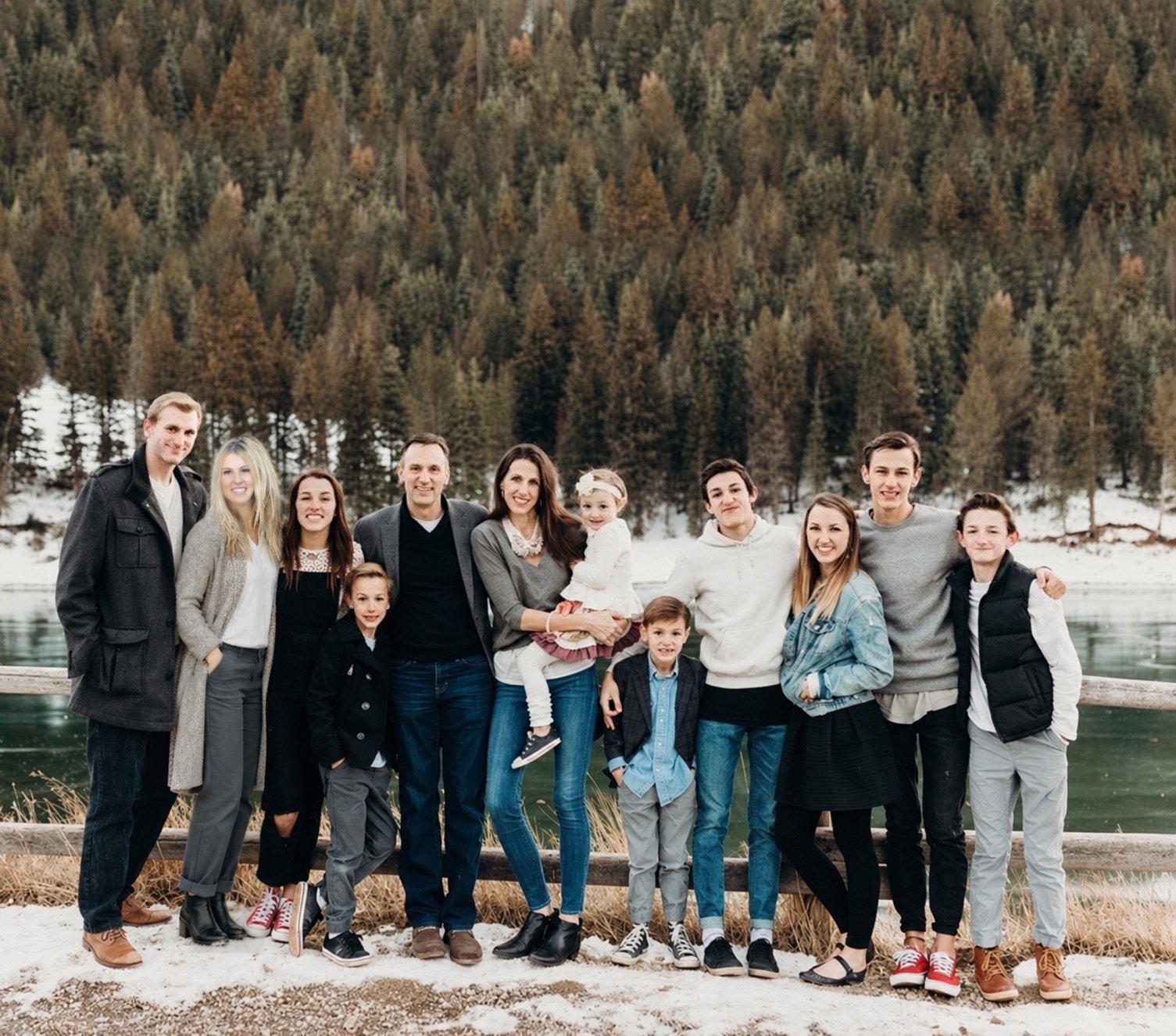 Jenny Free with her family near a snowy mountain lake
